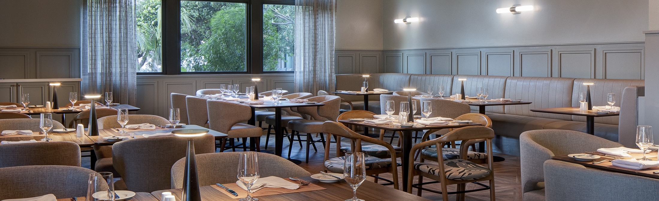 Indoor image of the tables inside the Drake Steakhouse without people hero image